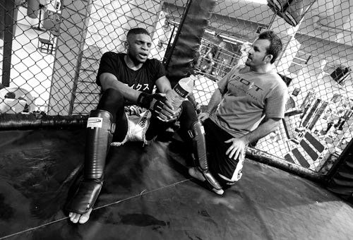 Paul Daley being coached after sparring, black and white photography by Doug Marke — image 7 of 8.